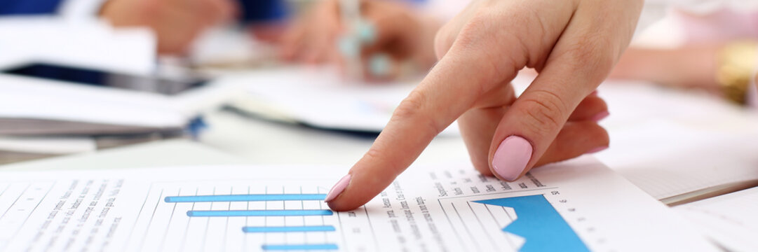 Female arm point pinger in financial graph