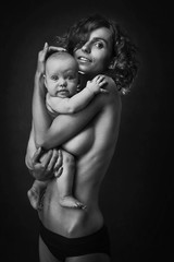 Young mother holding a baby in her arms