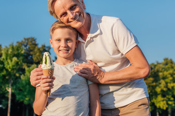 grandfather and child with ice cream