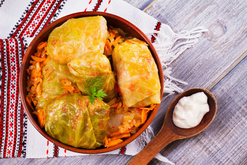 Cabbage rolls with meat, rice and vegetables. Stuffed cabbage leaves with meat. Dolma, sarma, sarmale, golubtsy or golabki. View from above, top studio shot
