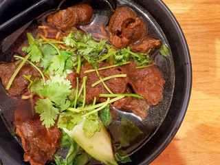 Bowls of Asian soup noodles beef and vegetables