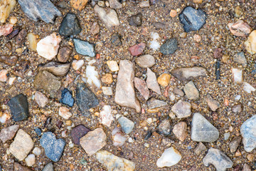 Sandy gravel background with many colors.