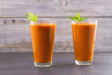 Apricot smoothie garnished with mint. Apricot milkshake cocktail. Fruit smoothie