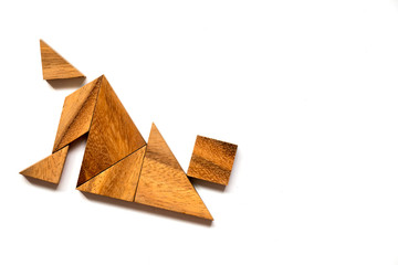 Wooden tangram puzzle in falling man shape on white background (Concept of business failure or crisis)