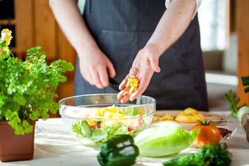 Obraz na płótnie Canvas Chef cutting fresh and delicious vegetables for salad