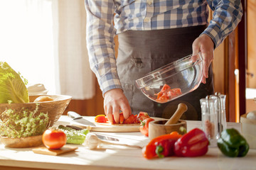 male cooking healthy salad