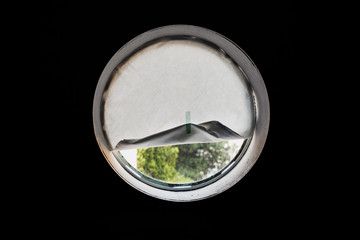 A circular window covered with paper
