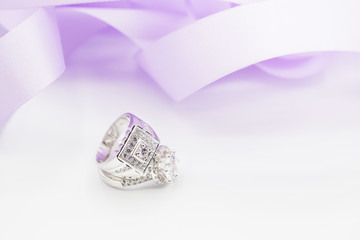 Diamond wedding rings on the white. selective focus