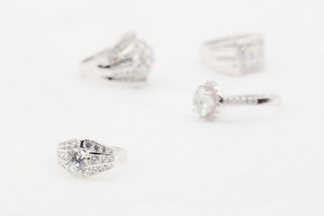 Diamond wedding rings on the white. selective focus