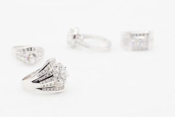 Diamond wedding rings on the white. selective focus