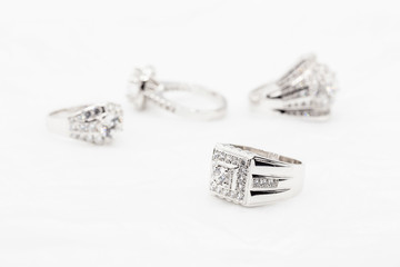 Diamond wedding rings on the white. selective focus