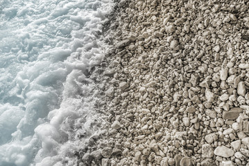 Sea surf on a stony beach.