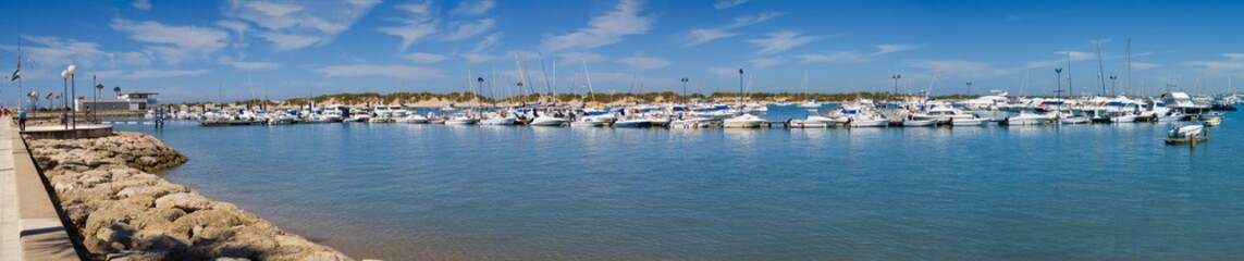 Fototapeta na wymiar Boats in the marina of the town of Sancti Petri in Chiclana, Cadiz, Spain