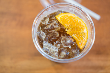 Ice americano with piece of orange