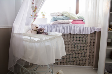 Interior of the room with a cot and window
