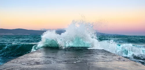 Foto op Plexiglas Sea waves in sunset with rocks and stones. Nature landscape. © Michael Sapryhin