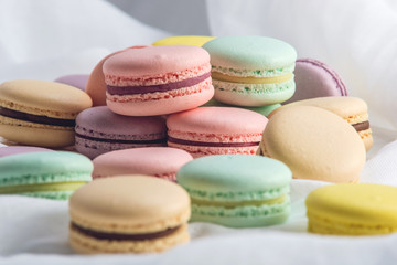 Fototapeta na wymiar Colorful macarons on a white background. French dessert