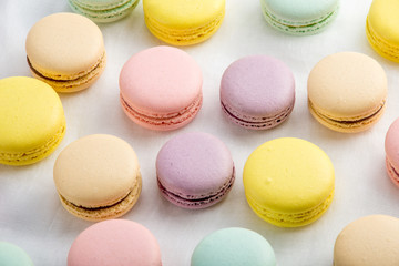 Colorful macarons on a white background. French dessert