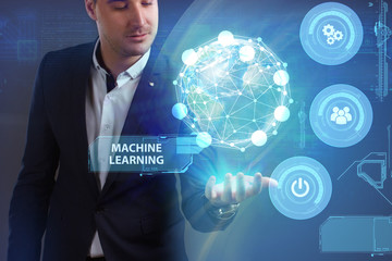 Business, Technology, Internet and network concept. Young businessman working on a virtual screen of the future and sees the inscription: Machine learning