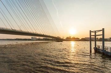 Fototapeta na wymiar Landscape view of suspension bridge with morning sunlight, Rama 8 Bridge