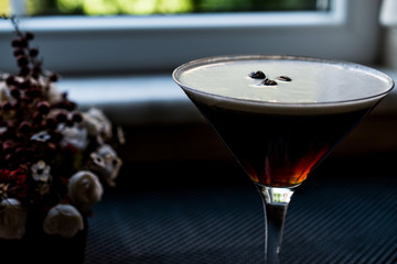 Espressso Martini Cocktail with coffee beans.