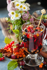 Herbal tea with berries, autumn healthy concept.