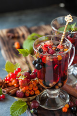 Herbal tea with berries, autumn healthy concept.