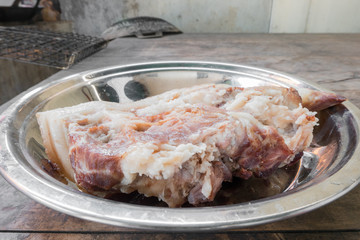 boil pork in steam pot, selective focus;