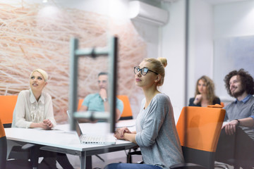 Startup Business Team At A Meeting at modern night office building