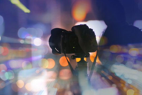 Camera with bokeh background as abstract style.
