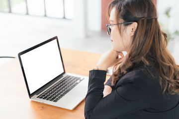 Asian young business freelance woman happiness working online business with Blank screen laptop in cafe shop. Working concept, in selective focus.