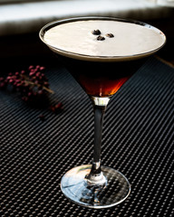 Espresso Martini Cocktail with coffee beans.