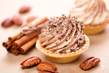 Delicious tartlets with chocolate cream, selective focus.