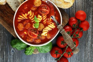 Tomato soup with meatballs in a bowl. Italian minestrone soup