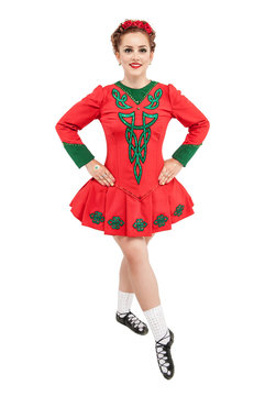 Beautiful woman in red dress for Irish dance isolated