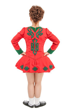 Beautiful woman in dress for Irish dance back pose isolated