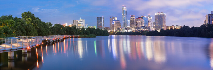 Panorama view of Downtown Austin, Texas, USA skylines reflection on the Colorado River at twilight....