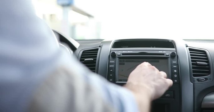 Person using navigation gps in car to travel to destination