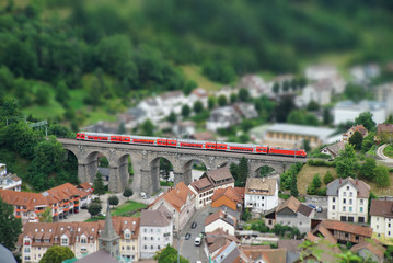 Train crossing old viaduct in Black Forest / Schwarzwald (pseudo miniature view)
