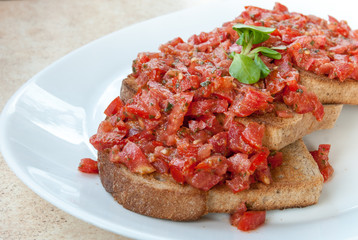 delicious italian style tomato bruschetta served on a plate