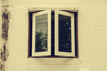 old white window on white old ancient building