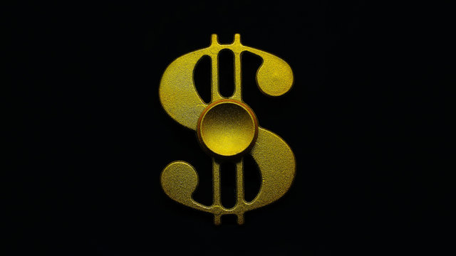 Visible Hand Held A Gold Form Of Money Sign Hand Spinner. Fidget Toy For Increased Focus, Stress Relief In A Black Isolated Background.