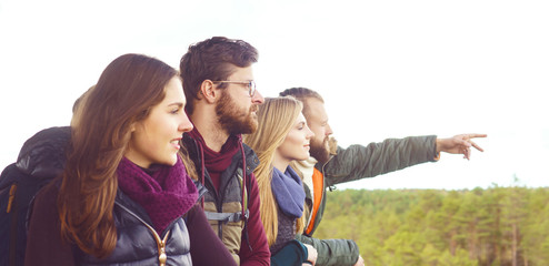 Group of happy friends standing on tower and enjoying views. Camp, tourism, hiking, trip, concept.