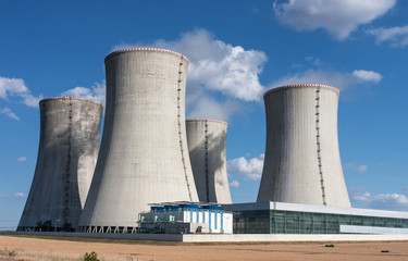 Nuclear power station, cooling towers against blue sky