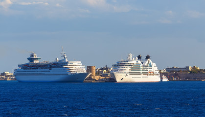 Fototapeta na wymiar two big white cruise ships in port of island of Rhodes, Greece.
