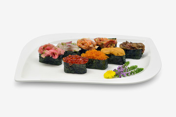 Mixed nigiri sushi (Uni(sea urchin), Ikura (salmon roe), Tobiko (flying fish roe), Otoro,Shutoro, salmon) in white plat on white background
