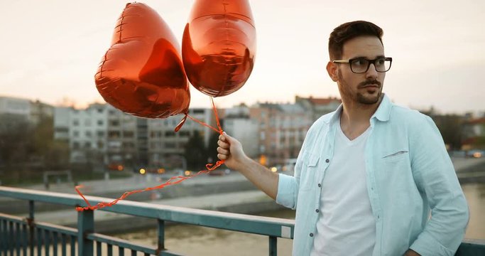 Sad man waiting for date on valentine date