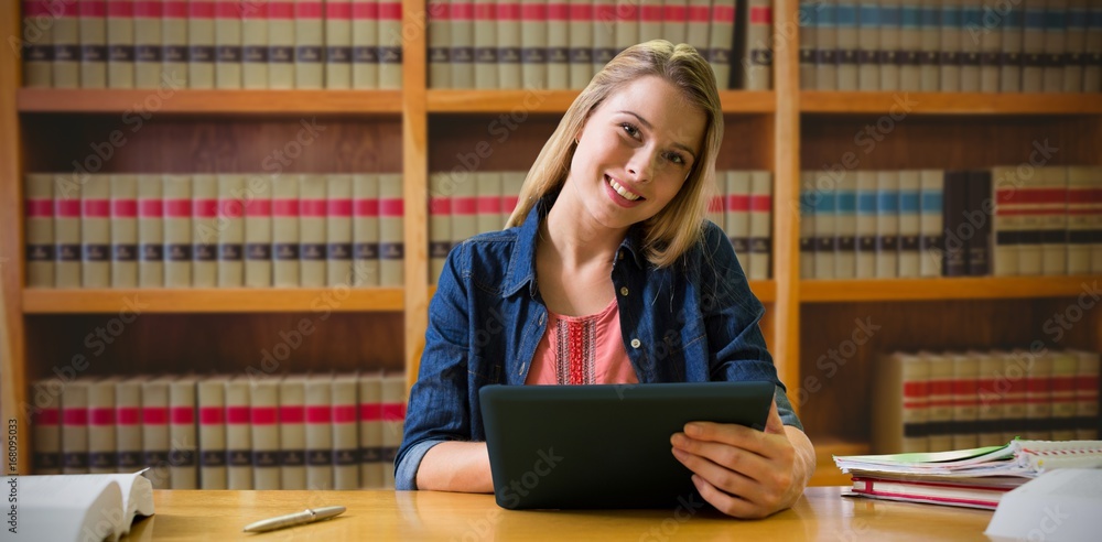 Aufkleber composite image of student studying in the library with tablet