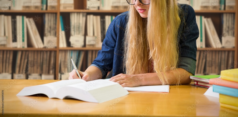 Poster composite image of student studying in the library