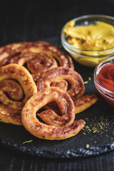 Potatoes and cheese spirals served on the table,selective focus